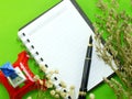 Dried flowers and empty notebook page Royalty Free Stock Photo