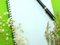 Dried flowers and empty notebook page Royalty Free Stock Photo