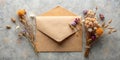 Dried Flowers and Envelope on Grey Background A Rustic Composition Royalty Free Stock Photo