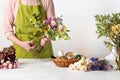 Dried flowers. Female florist arranging dried flowers into a beautiful bouquet. Sustainable floristry.