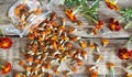 Dried flowers of marigolds on a wooden background. The use of flowers Chernobrovtsy or Mary is Gold in folk alternative medicine Royalty Free Stock Photo