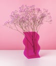 Dried flowers in pink vase. Valentines day concept. Beautiful tender flowers bunch at table. Home floral decor