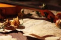 Dried flowers and vintage violin on old torn music notes closeup. Selective focus Royalty Free Stock Photo