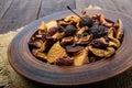 Dried fruit apples, pears, apricots, berries in a bowl on dark wooden background. Royalty Free Stock Photo