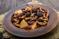 Dried fruit apples, pears, apricots, berries in a bowl on dark wooden background. Royalty Free Stock Photo