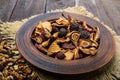 Dried fruit apples, pears, apricots, berries and nuts in a bowl on dark wooden background. Royalty Free Stock Photo