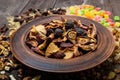 Dried fruit apples, pears, apricots, berries, raisins and nuts in a bowl on dark wooden background. Royalty Free Stock Photo