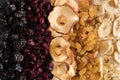 Dried fruit background. Plums, cranberries, apples, raisins, bannanas. Top view.