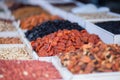 Dried fruit background. Rows of dried dates, apricots, nuts, prunes. Royalty Free Stock Photo