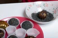 Dried fruit sweets. Balls of prunes, dates and coconut. With a sprinkle of black sesame powder Royalty Free Stock Photo