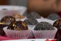 Dried fruit sweets. Balls of prunes, dates and coconut. With a sprinkle of black sesame powder Royalty Free Stock Photo