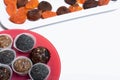 Dried fruit sweets. Balls of prunes, dates and coconut. With a sprinkle of black sesame powder Royalty Free Stock Photo