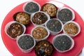 Dried fruit sweets. Balls of prunes, dates and coconut. With a sprinkle of black sesame powder Royalty Free Stock Photo