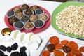 Dried fruit sweets. Balls of prunes, dates and coconut. With a sprinkle of black sesame powder Royalty Free Stock Photo