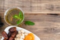 Dried fruit tray with tea glass on wooden background. Copy space Royalty Free Stock Photo