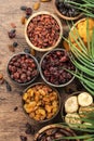 Dried fruits bowl. Healthy food snack: sun dried organic mix of apricots, figs, raisins, dates and other on wooden table, top view Royalty Free Stock Photo