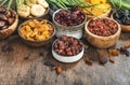 Dried fruits bowl. Healthy food snack: sun dried organic mix of apricots, figs, raisins, dates and other on wooden table, top view Royalty Free Stock Photo
