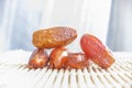 Dried fruits of date palm on bamboo mat background, Phoenix fruit on bamboo mat