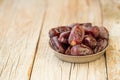 Dried fruits date palm fruits . fresh dates whole and half on wood background