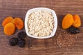 Dried fruits, linseed and oatmeal in bowl, increase metabolism