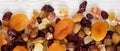 Dried fruits and nut mix on white wooden background, top view. Overhead, from above, flat lay Royalty Free Stock Photo