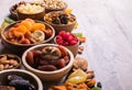 Dried fruits and nuts mix in a wooden bowl. Assortment of candied fruits. Judaic holiday Tu Bishvat. Copy space