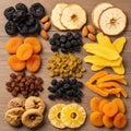 Dried fruits and nuts are neatly arranged on a wooden surface Royalty Free Stock Photo