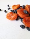 Dried fruits raisins and dried apricots on a white background