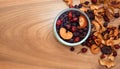 Dried fruits: rose hips, hawthorn, apples, pears, plums in a glass jar on a wooden table - healthy sweet food Royalty Free Stock Photo