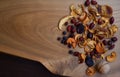 Dried fruits: rose hips, hawthorn, apples, pears, plums on a wooden table - healthy sweet food Royalty Free Stock Photo