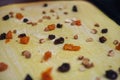 Dried fruits on sheet of yeast dough