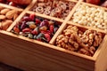 Dried fruits, various nuts and seeds in wooden box Royalty Free Stock Photo