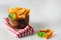 Dried fruits in Wooden Bowl Kiwi Persimmon Melon Gray Background Horizontal Linen Napkin Copy Space