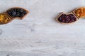 Dried fruits in a wooden bowls on the table. Wave shape.