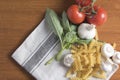 Dried fusilli pasta with tomatoes, basil and garlic Royalty Free Stock Photo