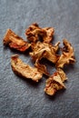 Dried Galangal Root in Close Up on Dark Stone Royalty Free Stock Photo