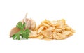 Dried garlic flakes and parsley on white background