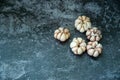 Dried garlic in wooden spoon on gray background, Garlic is ingedient of Thai food