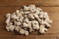 Pile of ginger roots on wooden table Royalty Free Stock Photo