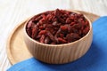 Dried goji berries in bowl on white wooden table, closeup Royalty Free Stock Photo