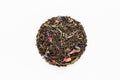 Dried green and black tea leaves with petals of cornflowers, roses, calendula, safflower on white background. Top view