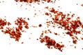 Dried ground red pepper and seeds on white Royalty Free Stock Photo