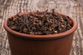 Dried herb, dried cloves on wooden background Royalty Free Stock Photo