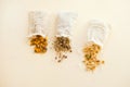 dried herbs at cotton white bags from above. Sachets filled with medicinal herbs and bunches Royalty Free Stock Photo