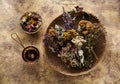 Dried herbs and flowers and herbal tea, top view Royalty Free Stock Photo