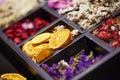 Dried Herbs and flowers in wooden box. Collage. Soft focus. Close up Royalty Free Stock Photo