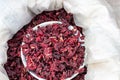 Dried herbs red rosella or dried red okra flowers in a bowl. Royalty Free Stock Photo