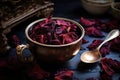 dried hibiscus petals in a teacup with a teaspoon