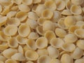 Dried italian orecchiette pasta food background Royalty Free Stock Photo