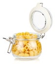 Dried italian pasta snail Pipe rigate in a open transparent glass jar with rubber seal and metal clamp on lid isolated on white Royalty Free Stock Photo